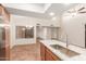 Modern kitchen features granite countertops, stainless steel sink, and tile flooring at 14413 N 91St St, Scottsdale, AZ 85260