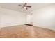 Empty living room with tile flooring and ceiling fan at 14413 N 91St St, Scottsdale, AZ 85260