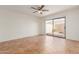 Bright living room with tile floors and sliding glass doors leading to patio at 14413 N 91St St, Scottsdale, AZ 85260