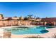 Inviting community pool with lounge chairs and shade structures at 14413 N 91St St, Scottsdale, AZ 85260