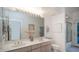 Bathroom with double sinks, a large mirror, and a shower at 14845 S 31St Way, Phoenix, AZ 85048