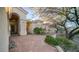 Elegant entryway with arched doorway and terracotta tile patio at 14845 S 31St Way, Phoenix, AZ 85048