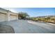 Two-car garage with a long driveway offering mountain views at 14845 S 31St Way, Phoenix, AZ 85048