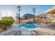 Relaxing kidney-shaped pool with a waterfall feature and lounge chairs at 14845 S 31St Way, Phoenix, AZ 85048