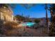 Landscaped backyard with a sparkling pool and spa at 14845 S 31St Way, Phoenix, AZ 85048