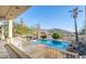 Inviting pool with mountain views, spacious patio, and lush landscaping at 14845 S 31St Way, Phoenix, AZ 85048