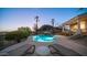 Stunning pool and spa at dusk, offering serene views and desert landscaping at 14845 S 31St Way, Phoenix, AZ 85048