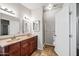 Bathroom features a double vanity, shower, and tile flooring at 150 S Windsor -- # F87, Mesa, AZ 85204