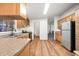 Galley-style kitchen featuring wood cabinets and stainless steel appliances at 150 S Windsor -- # F87, Mesa, AZ 85204