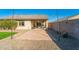 Landscaped backyard with patio, artificial turf, and gravel at 1537 E Caballero Dr, Casa Grande, AZ 85122