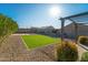 Backyard with pergola, artificial turf, and gravel at 1537 E Caballero Dr, Casa Grande, AZ 85122