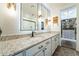 Elegant bathroom with granite countertops, a large mirror, and a walk-in closet at 1537 E Caballero Dr, Casa Grande, AZ 85122