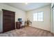 Cozy bedroom with built-in shelving and carpeted flooring at 1537 E Caballero Dr, Casa Grande, AZ 85122