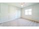 Bright bedroom with ceiling fan and double door closet at 1537 E Caballero Dr, Casa Grande, AZ 85122