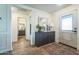 Bright and airy entryway with wood-look floors and modern console table at 1537 E Caballero Dr, Casa Grande, AZ 85122