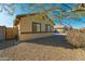 Single story home with side yard and wooden gate at 1537 E Caballero Dr, Casa Grande, AZ 85122