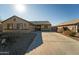 Single-story home with a two-car garage and desert landscaping at 1537 E Caballero Dr, Casa Grande, AZ 85122