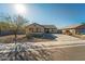 Single-story home with a two-car garage and desert landscaping at 1537 E Caballero Dr, Casa Grande, AZ 85122