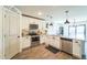 Modern kitchen with white cabinets, granite counters, and tile backsplash at 1537 E Caballero Dr, Casa Grande, AZ 85122