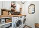 Bright laundry room features washer, dryer, and ample storage at 1537 E Caballero Dr, Casa Grande, AZ 85122