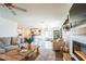 Open concept living room with kitchen views and modern fireplace at 1537 E Caballero Dr, Casa Grande, AZ 85122