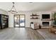 Living room with fireplace, patio access, and built-in shelving at 1537 E Caballero Dr, Casa Grande, AZ 85122