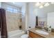 Bathroom features a tub, shower, and wood vanity at 1572 E Artemis Trl, Queen Creek, AZ 85140