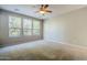 Bright bedroom with neutral walls and carpet flooring at 1572 E Artemis Trl, Queen Creek, AZ 85140