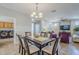 Dining area with seating for six and access to the kitchen at 1572 E Artemis Trl, Queen Creek, AZ 85140