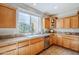 Kitchen with ample counter space and wood cabinetry at 1572 E Artemis Trl, Queen Creek, AZ 85140