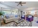 Living room with a view of the kitchen and backyard access at 1572 E Artemis Trl, Queen Creek, AZ 85140