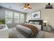 Bright bedroom featuring neutral walls, carpet flooring, and a ceiling fan that complements the cozy aesthetic at 1572 E Artemis Trl, Queen Creek, AZ 85140