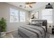 Comfortable bedroom featuring natural light from multiple windows that enhances the room's soothing color palette at 1572 E Artemis Trl, Queen Creek, AZ 85140