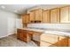 Home office with built-in cabinets and wood countertops at 1572 E Artemis Trl, Queen Creek, AZ 85140