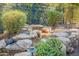 Charming water feature and lush landscaping at 1572 E Artemis Trl, Queen Creek, AZ 85140