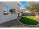 Landscaped backyard with grassy area and gravel at 16000 W Sherman St, Goodyear, AZ 85338