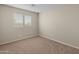 Bright bedroom with neutral walls and carpet flooring at 16000 W Sherman St, Goodyear, AZ 85338