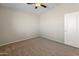 Bright bedroom with ceiling fan and carpet flooring at 16000 W Sherman St, Goodyear, AZ 85338