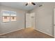 Well-lit bedroom featuring a window and closet at 16000 W Sherman St, Goodyear, AZ 85338