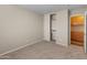 Well-lit bedroom with carpet floor and built-in shelves at 16000 W Sherman St, Goodyear, AZ 85338