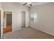 Spacious bedroom with mirrored closet doors and carpet at 16000 W Sherman St, Goodyear, AZ 85338