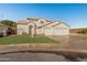 Two-story house with three-car garage and landscaped lawn at 16000 W Sherman St, Goodyear, AZ 85338