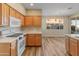 Eat-in kitchen with wood cabinets and quartz countertops at 16000 W Sherman St, Goodyear, AZ 85338