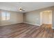 Spacious living room with wood-look flooring at 16000 W Sherman St, Goodyear, AZ 85338