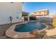 Relaxing kidney-shaped pool in the backyard at 16000 W Sherman St, Goodyear, AZ 85338