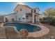 Inviting kidney-shaped pool with a large backyard at 16000 W Sherman St, Goodyear, AZ 85338