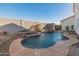 Stunning kidney-shaped pool with a large patio at 16000 W Sherman St, Goodyear, AZ 85338