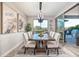 Modern dining room with a large table, view to the backyard and a modern chandelier at 18022 E Vista Desierto --, Rio Verde, AZ 85263