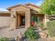 Stone and stucco exterior with a covered entryway at 18022 E Vista Desierto --, Rio Verde, AZ 85263