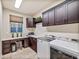 Spacious laundry room with washer, dryer, and ample storage at 18022 E Vista Desierto --, Rio Verde, AZ 85263